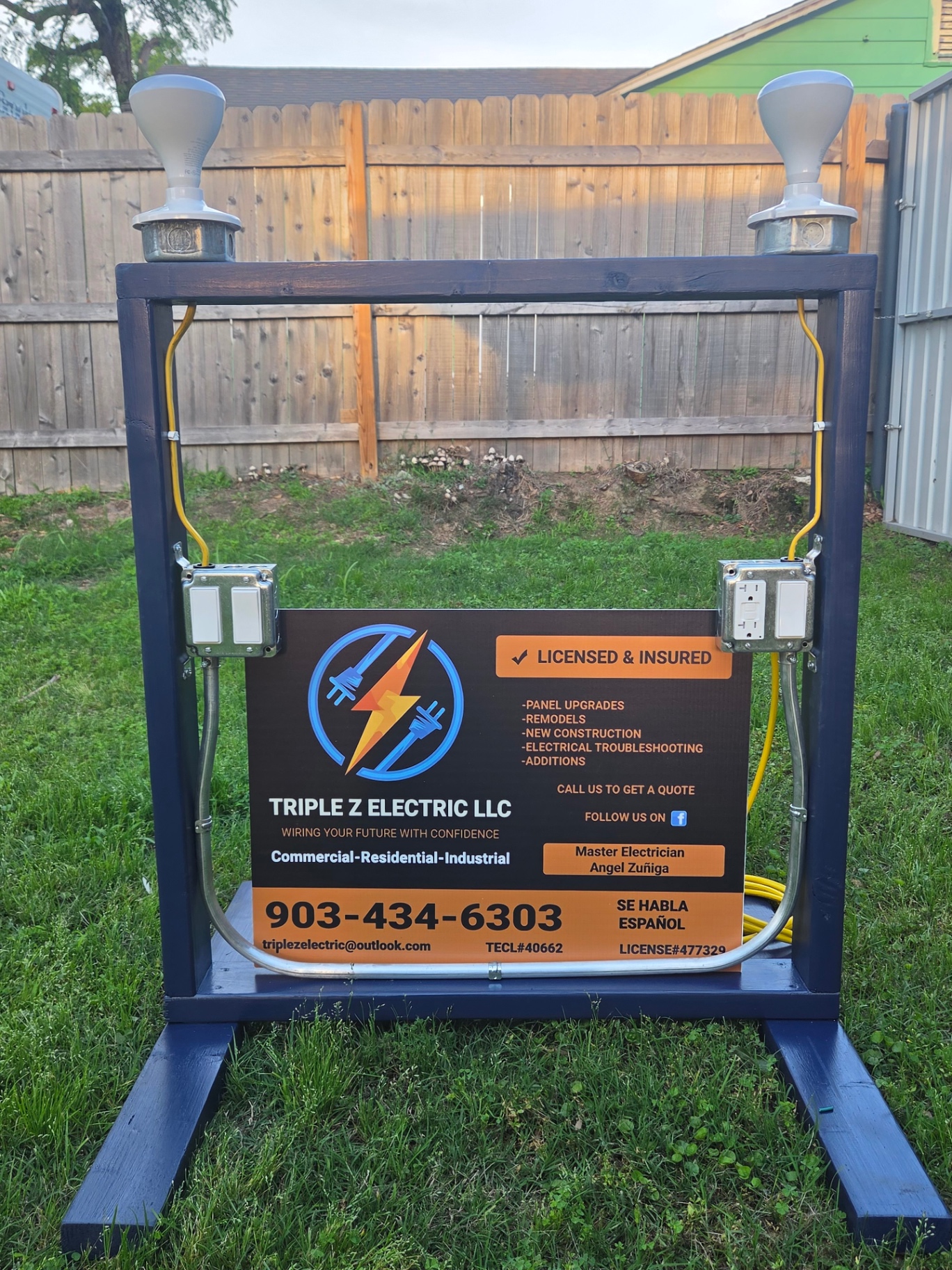 Hands-on wiring demo board built by Triple Z Electric showing a 3-way switch, GFCI receptacle and single-pole switch